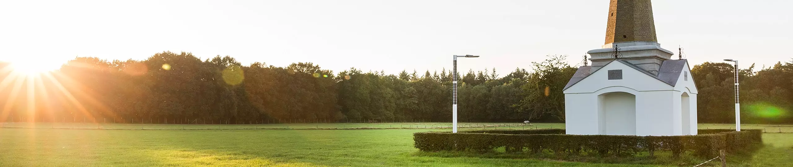 FlexSol Soluxio solar energy sustainable public lighting pole at sunset near monument