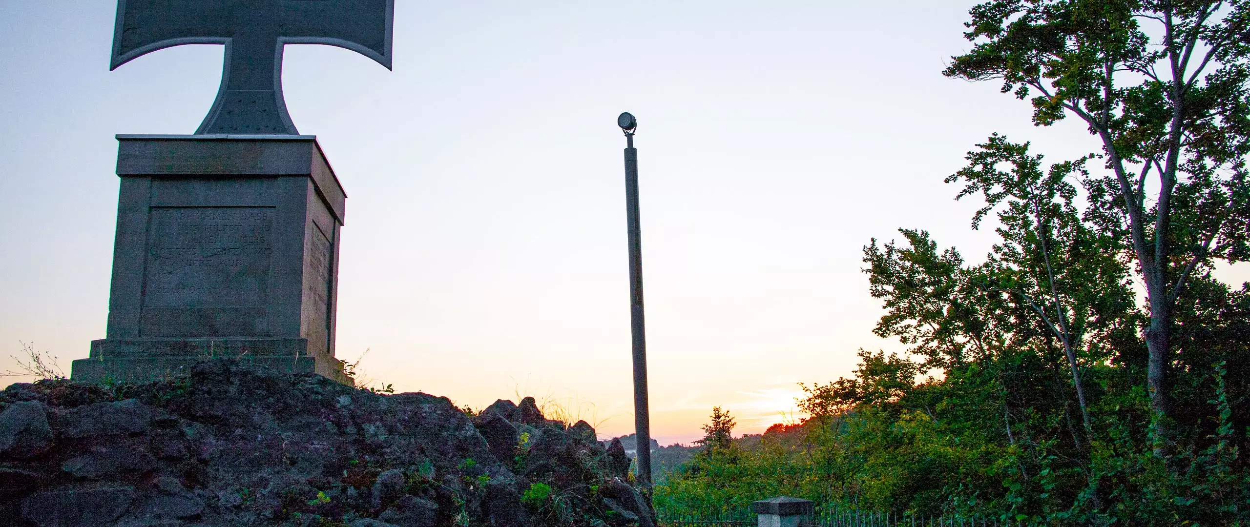Solar-powered monument lighting pole at sunset Solar-powered monument lighting pole at sunset